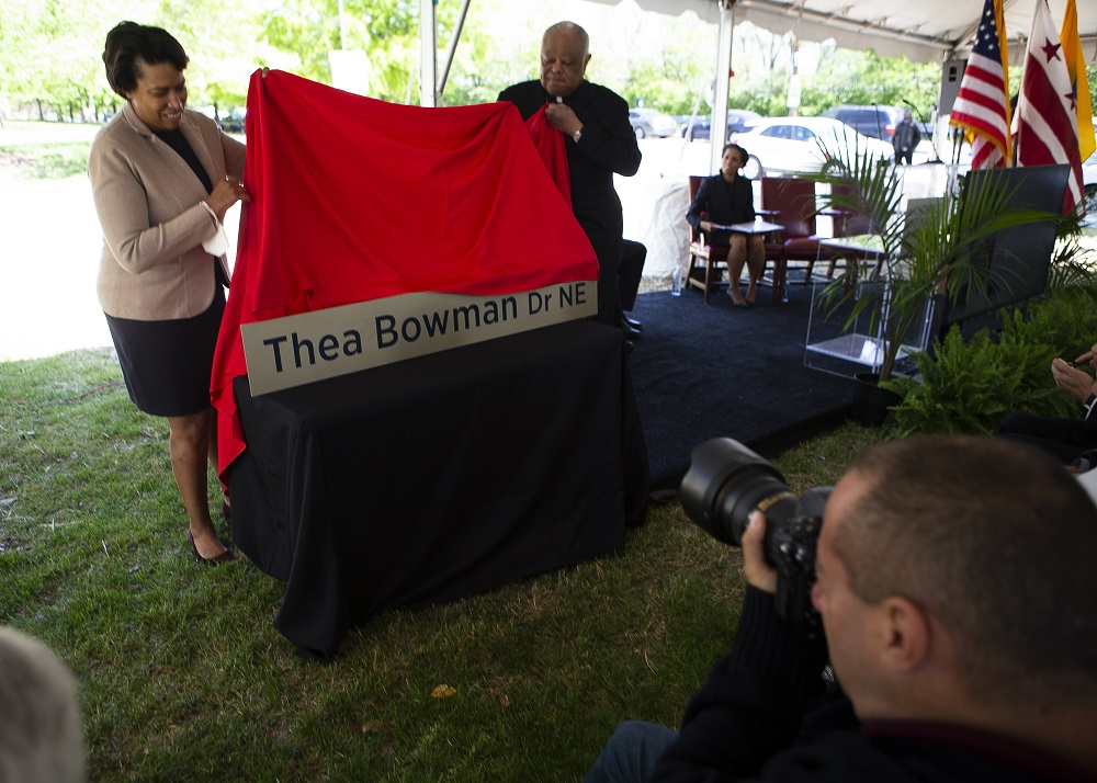 Washington Cardinal Wilton Gregory and Mayor Muriel Bowser of the District of Columbia participate in the dedication and blessing of Sister Thea Bowman Drive on April 29 at the Catholic University of America in Washington. (CNS/Tyler Orsburn)