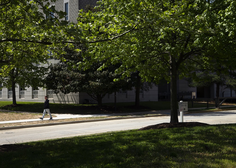 A person in Washington walks along Sister Thea Bowman Drive at the Catholic University of America in Washington on April 29. (CNS/Tyler Orsburn)