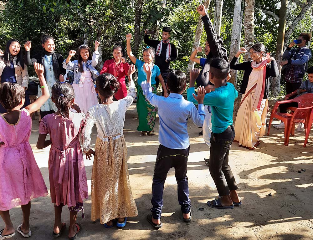 Sister Leema leads a dance, assisted by children who are boarders and joined by children of the village of Ratanpur, North-Eastern India, during Christmas 2020. (Courtesy of Frida Toppo)