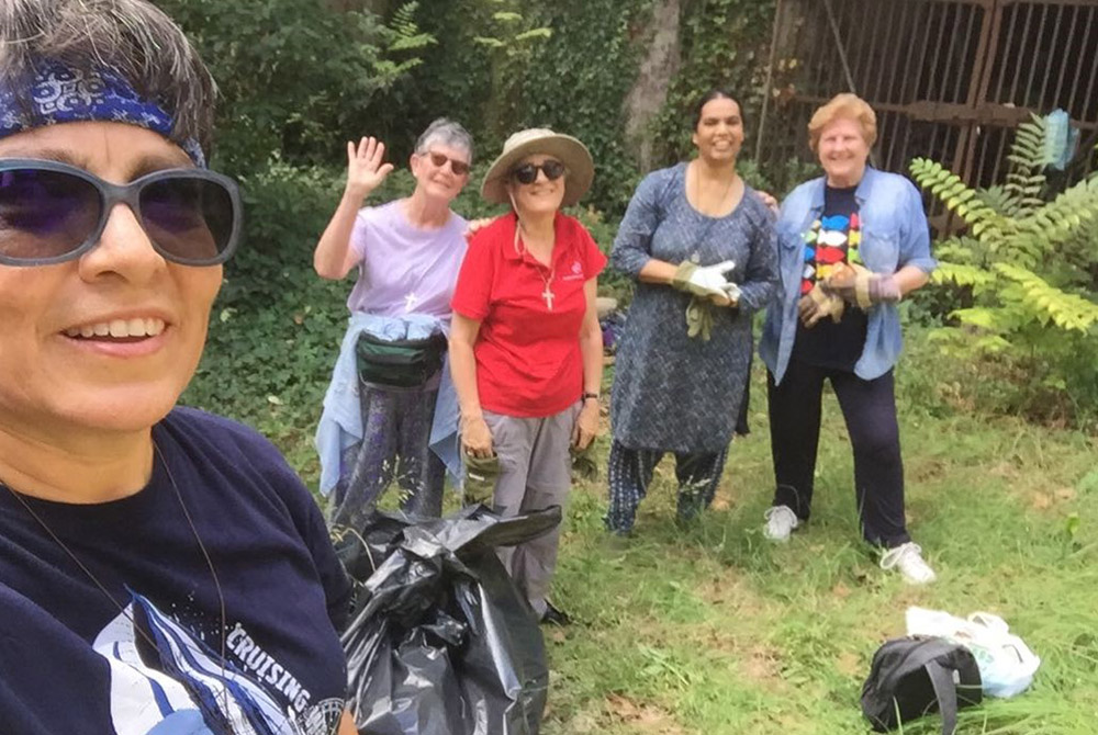 A group of sisters from the Religious of the Sacred Heart generalate in Rome clean a garden at one of congregation’s convents near the Janiculum Hill in Rome. The congregation has a number of environmental ministries, including one in Colombia focusing on