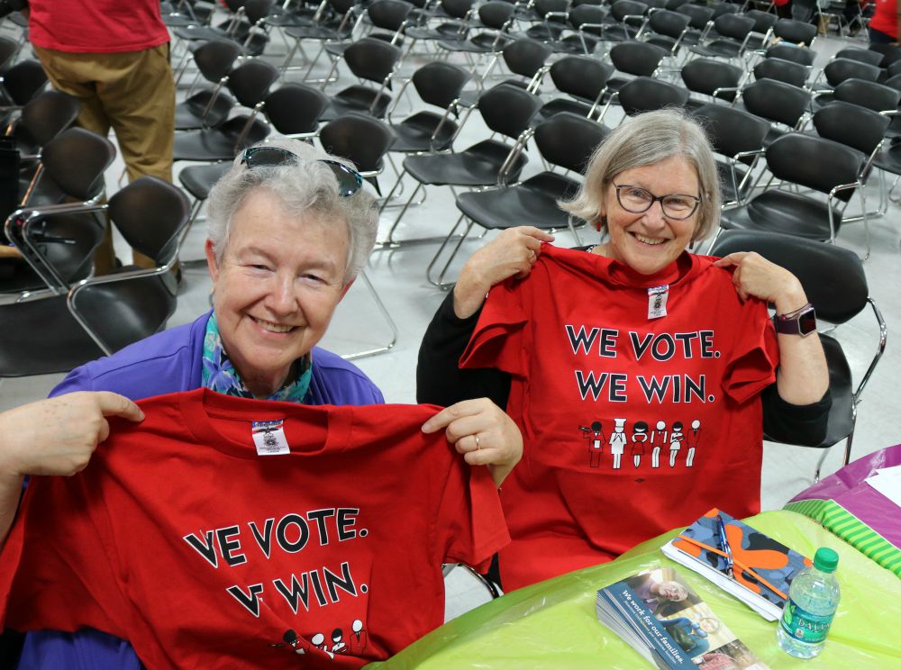 GSR's Sr. Michele Morek, left, and Sr. Simone Campbell show off their red shirts from the Culinary Workers Union Local 226 for canvassing Las Vegas neighborhoods (Network Lobby for Catholic Social Justice / Colleen Ross)