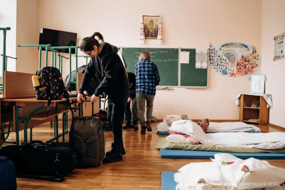 People displaced by the war in Ukraine get settled in a classroom at St. Basil the Great High School in Ivano-Frankivsk in March. (CNS/Courtesy of the Archeparchy of Ivano-Frankivsk)