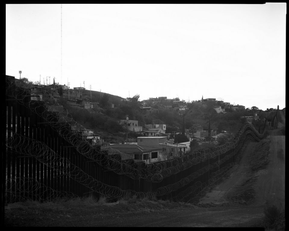 The community of Nogales, Mexico, as seen over the Arizona border fence in January. The city utilizes every inch of its side of the wall. (© Lisa Elmaleh)