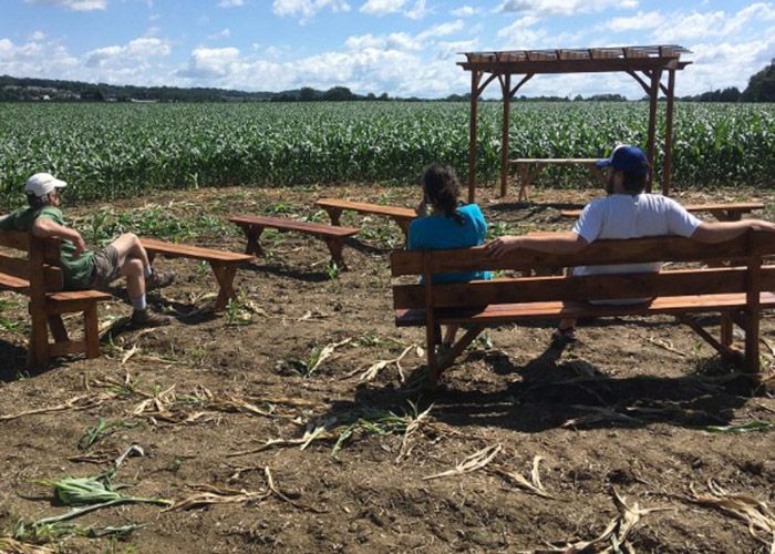 People sit at an outdoor chapel on the property of the Adorers of the Blood of Christ in 2017 in Columbia, Pennsylvania. (CNS/Mark Clatterbuck, courtesy of Lancaster Against Pipeline)