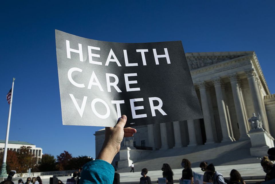 People demonstrate in support of the Affordable Care Act outside the U.S. Supreme Court Nov. 10 in Washington. (CNS/Tyler Orsburn)