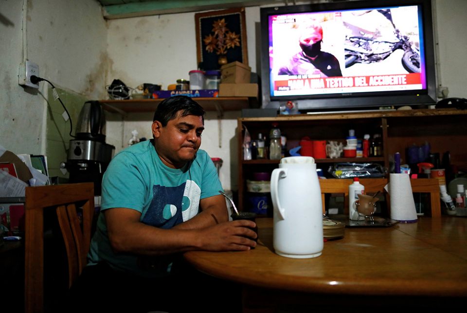 Gustavo Delgado, 52, who lost his job because of the COVID-19 pandemic, drinks a mate Dec. 15, 2020, at his home in Buenos Aires, Argentina. (CNS/Reuters/Agustin Marcarian)
