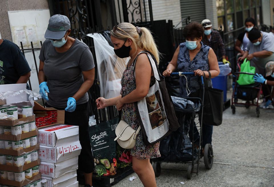 People receive food donations July 13 from a food pantry outside a church in the Bronx borough of New York City. (CNS/Reuters/Shannon Stapleton) People receive food donations July 13 from a food pantry outside a church in the Bronx borough of New York City. (CNS/Reuters/Shannon Stapleton)