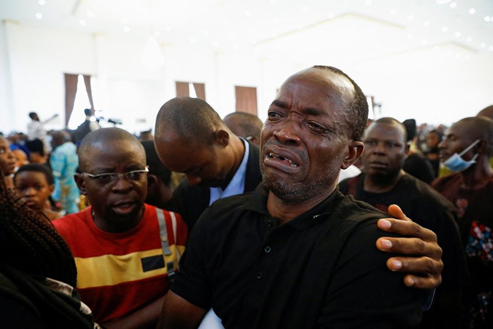 A man cries during a funeral Mass on June 17 in the parish hall of St. Francis Xavier Church in Owo, Nigeria. The Mass was for some of the 40 victims killed in a June 5 attack by gunmen during Mass at the church. (CNS/Reuters/Temilade Adelaja) A man cries during a funeral Mass on June 17 in the parish hall of St. Francis Xavier Church in Owo, Nigeria. The Mass was for some of the 40 victims killed in a June 5 attack by gunmen during Mass at the church. (CNS/Reuters/Temilade Adelaja)