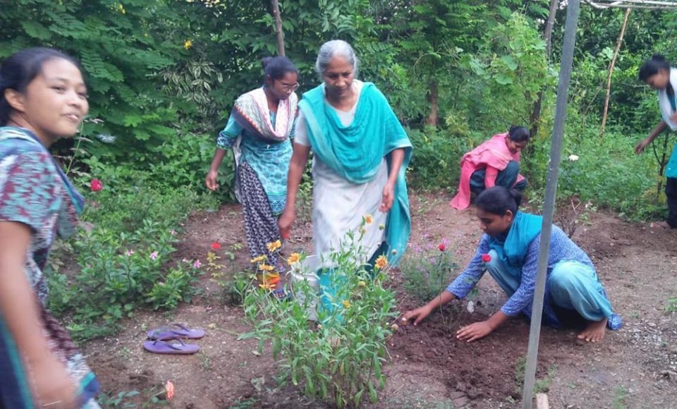 Sister Molly, manager of the farm at Deepalaya, run by the Medical Mission Sisters in Khandwa, Madhya Pradesh, India, leads novices in planting. (Courtesy of Celine Paramundayil)