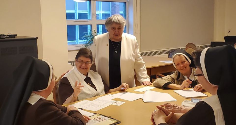 Dominican Sr. Patricia Wormann (in white jacket), delegate for religious for the Archdiocese of Newark, New Jersey facilitates a synod listening session with the Felician Sisters of Lodi, New Jersey. (Courtesy of Donna Ciangio)