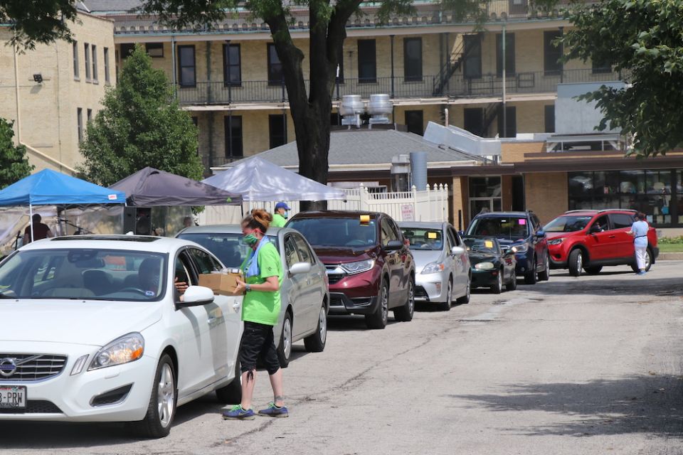 Staff and volunteers fill drive-through orders at the 2020 School Sisters of St. Francis' Sister Water Beer Garden in a Box fundraiser. (Courtesy of the School Sisters of St. Francis)