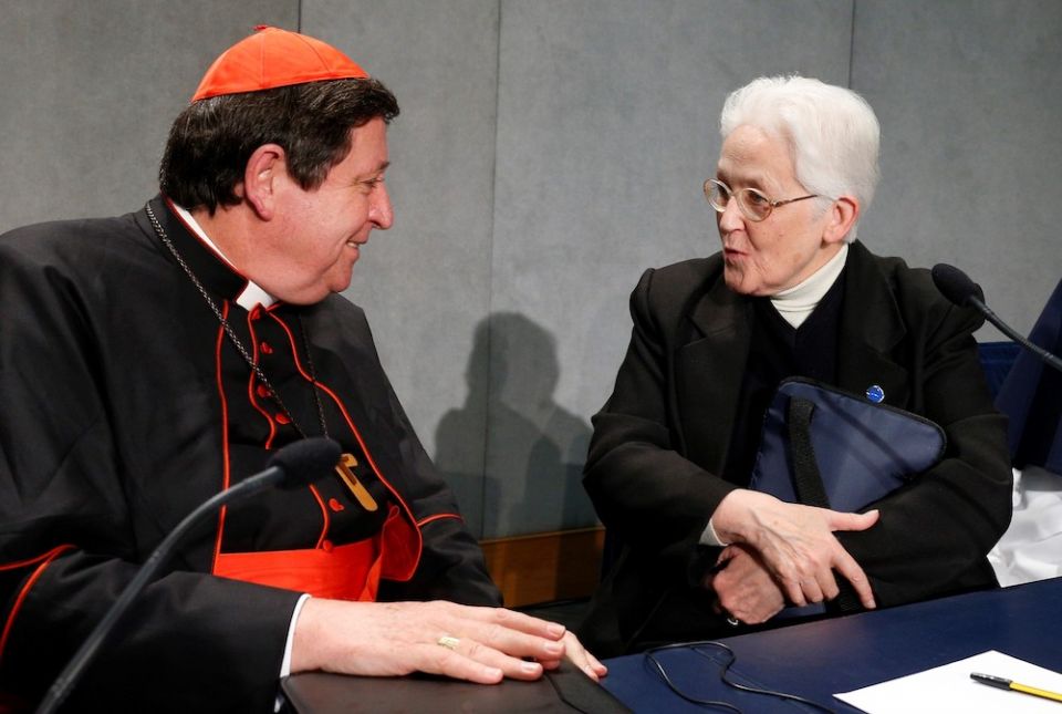 Brazilian Cardinal João Bráz de Aviz speaks with Immaculate Heart of Mary Sr. Sharon Holland, then president of the Leadership Conference of Women Religious, at the conclusion of a Dec. 16, 2014, Vatican press conference on the release of the final report