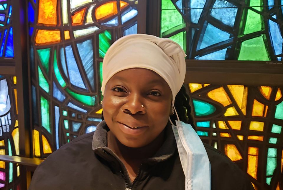 Veronica Garcia at her home parish, St. Frances of Rome Church in the Bronx, New York City. Cabrini Immigrant Services' legal services helped Garcia settle her immigrant status, and she receives food twice a month as one of the agency's regular clients. (