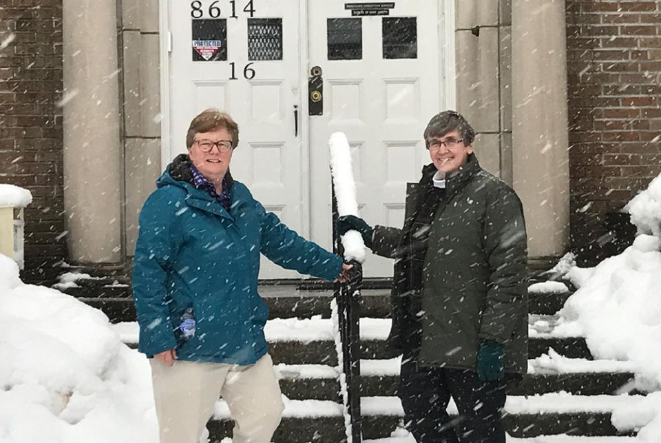Sr. Marie Mackey, Sisters of St. Joseph of Brentwood, New York, left, and School Sister of Notre Dame Sr. Nancy Gilchriest on the steps of Christus Vivit Community House in Jamaica, in the Queens borough of New York. (Provided photo)