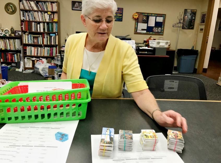 School Sister of Notre Dame Cathy Doherty shows off some of the materials she used to help local students learn about Marian apparitions around the world.