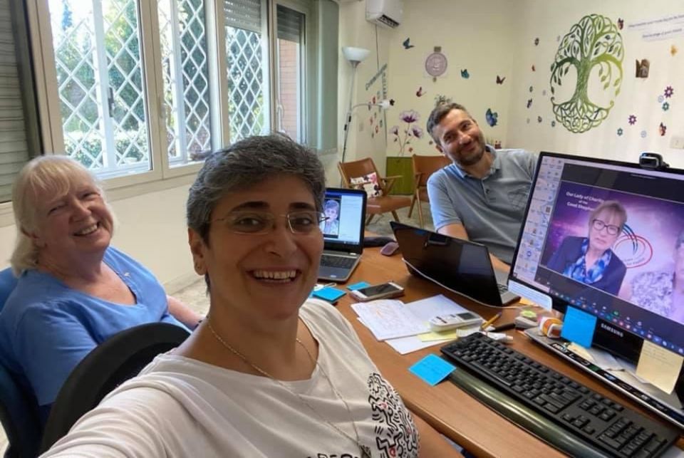 Good Shepherd Sr. Mary Farren, left, Good Shepherd Sr. Monique Tarabeh and technical consultant Marco Grottesi pause while working in Rome on the congregation's intercontinental assemblies, which were held virtually between August and October. (Courtesy o