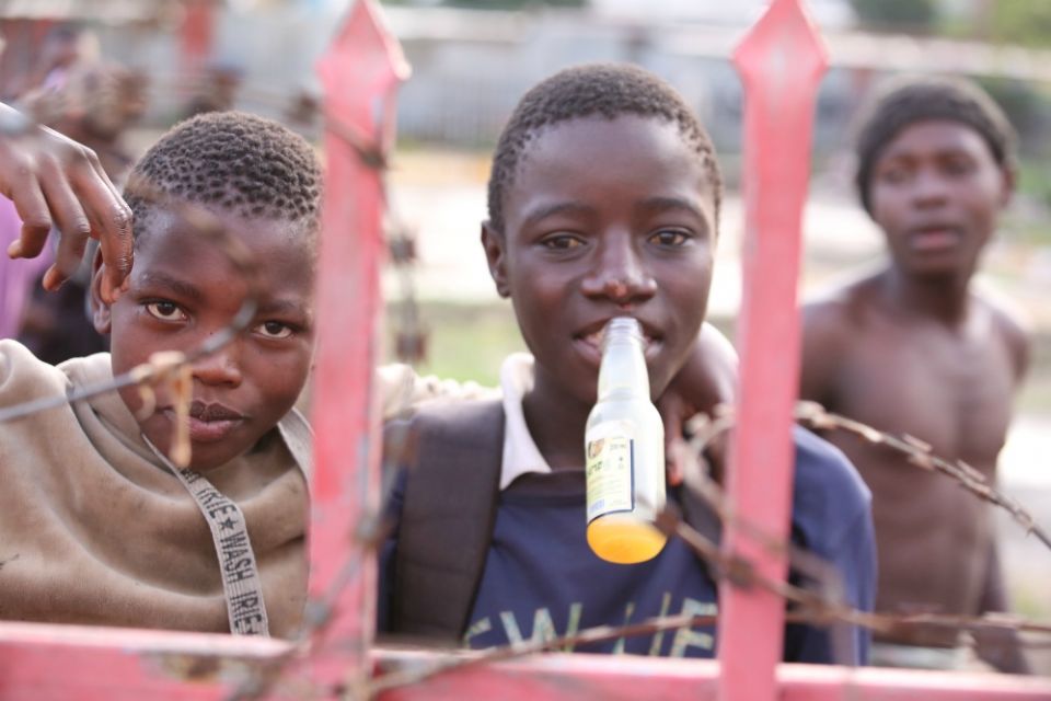 A homeless boy sniffs toxic glue on the streets of Nairobi, Kenya. Street children do this to beat hunger pangs, stay warm and feel good from the high, but health officials warn that glue sniffing presents a serious danger to them. (Doreen Ajiambo)