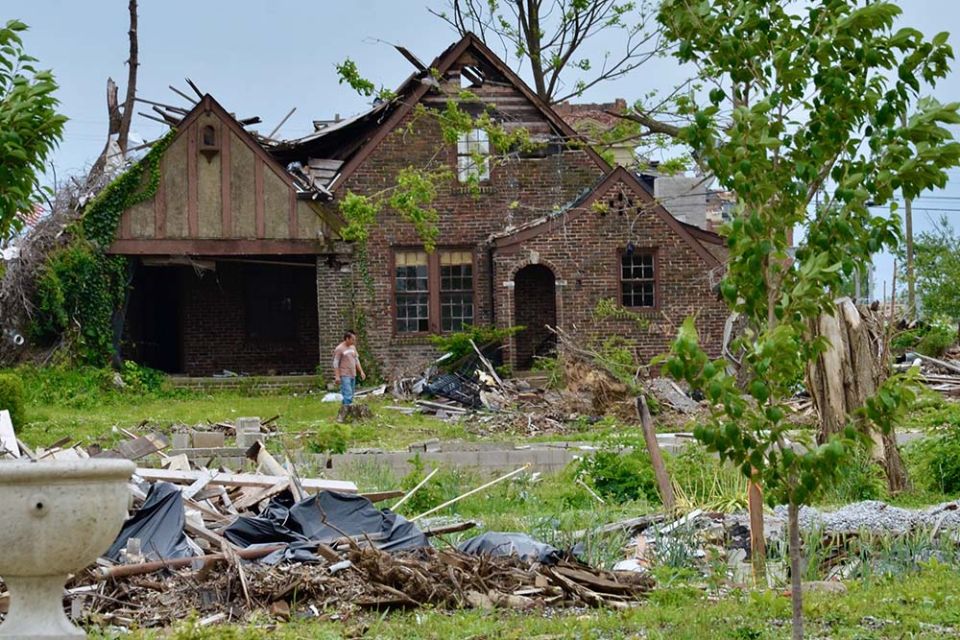 A man wanders amid the debris of a home in Mayfield, Kentucky, on May 23, almost six months after an EF4 tornado tore through the town. (GSR photo/Dan Stockman)