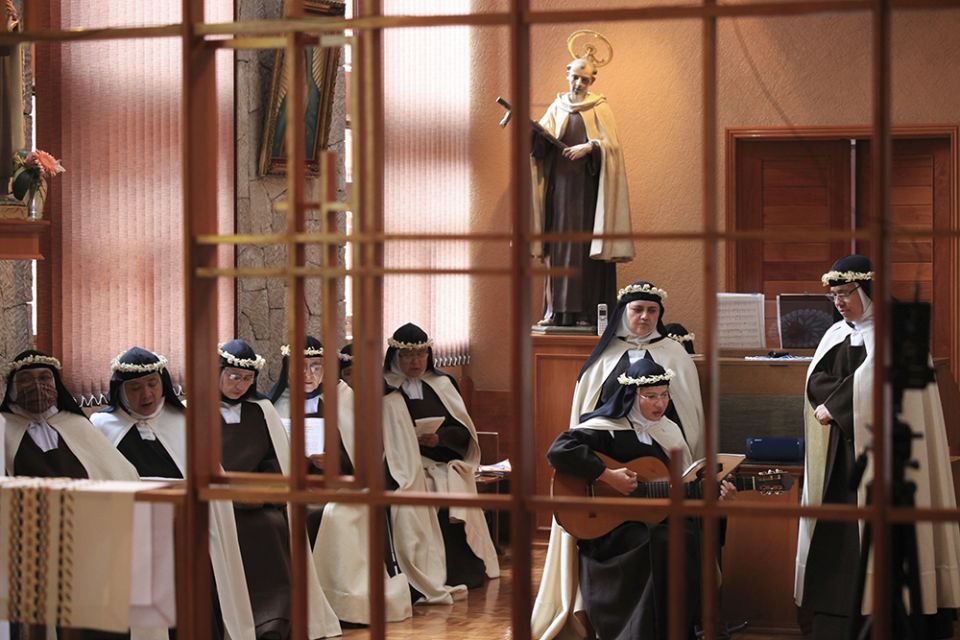 Carmelite nuns attend a Mass in Our Lady of Soledad and Saint Jose church in Puebla, Mexico, on Sept. 15. (AP Photo/Pablo Spencer)