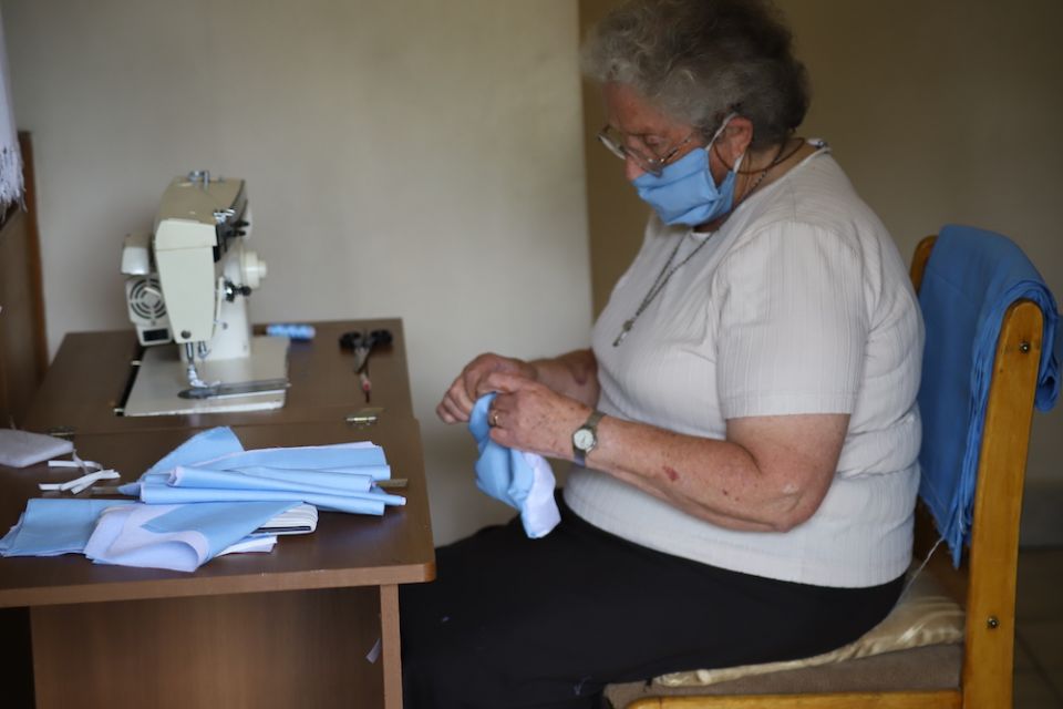 Sr. Miriam Duggan makes masks to be distributed in the slums to help protect residents against COVID-19 at Cheshire home for the elderly in the Kariobangi slum outside of Nairobi, Kenya. (Doreen Ajiambo)