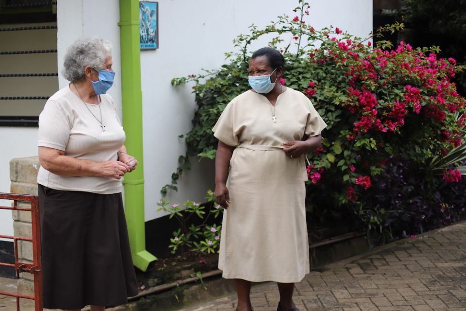Sr. Miriam Duggan, left, interacts with another sister at Cheshire home for the elderly in Kariobangi slum in outside Nairobi, Kenya. (Doreen Ajiambo)