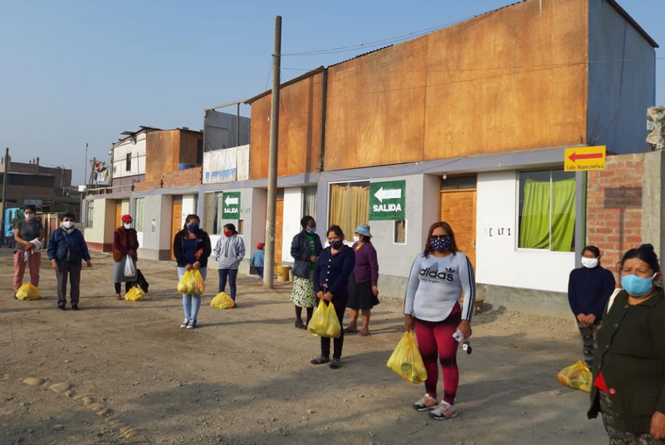 Women distribute food in Cajamarquilla outside Lima, Peru, buying large quantities at affordable prices to sell cheaply to the community while making a small profit for themselves, said Sr. Socorro Palomino. (Courtesy of Socorro Palomino)
