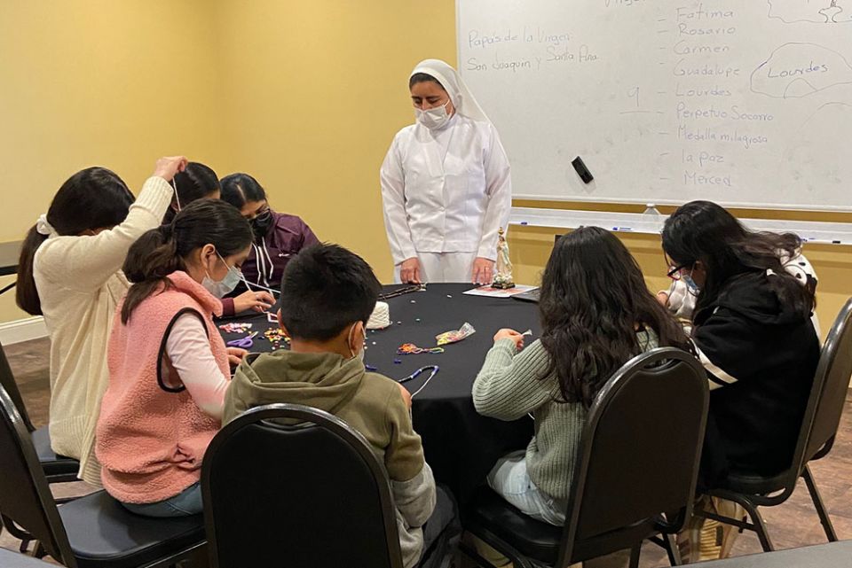 Sr. Ignacia García Ramos teaches an afterschool faith formation class for elementary school students in March at Centro de San Juan Diego in Lexington, Kentucky. (Courtesy of Luz Bejarano)