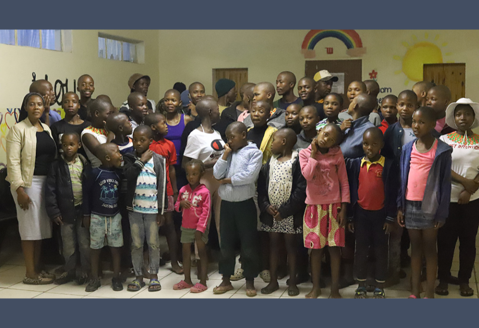 Sr. Eusebia Maselitso Lerotholi, a member of Handmaids of Christ the Priest, with the children at Andrew Blais Orphanage Home. Lerotholi founded the orphanage in 2013 to help homeless and orphaned children have a home and access to education. (GSR)