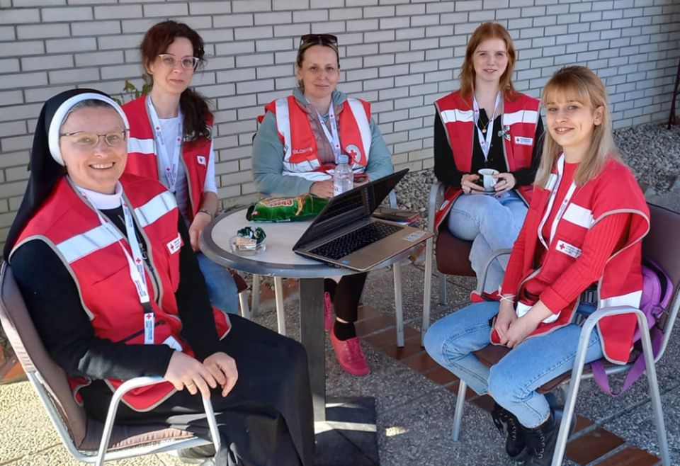 Sister Veronica Galatan, left, serves as a part of a Red Cross team consisting of a psychologist, a translator and student volunteers. (Courtesy of Sisters of St. Basil the Great)