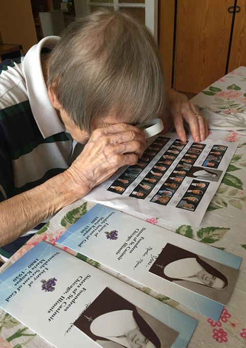 Sr. Jone Sofija Budryte looks at a photo of the Sisters of St. Casimir of Chicago in her kitchen in Vilnius, Lithuania. (Courtesy of the Sisters of St. Casimir) Sr. Jone Sofija Budryte looks at a photo of the Sisters of St. Casimir of Chicago in her kitchen in Vilnius, Lithuania. (Courtesy of the Sisters of St. Casimir)