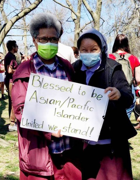 Assumption Srs. Akeneta Lalakobouma, left, and Gertrude Borres join a demonstration against anti-Asian hate in March in Philadelphia. (Courtesy of Gertrude Borres)
