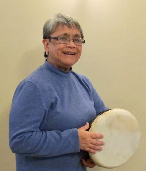 Sr. Terri Laureta playing a hand drum (Courtesy of Terri Laureta)