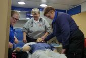 Paramedic students Destiny Hatfield, left, and Lyn Garison, right, work through a simulated emergency medical scenario as teacher Sr. Kathy Limber looks on at Southwest Virginia Community College in Cedar Bluff. (Provided photo)