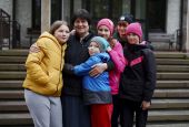 Sr. Antonina Sinicka, a member of the Congregation of Sisters of the Angels, poses with five of the children from a group home in Zhytomyr, Ukraine, at the congregation's motherhouse in Konstancin-Jeziorna, Poland, on April 20. (CNS/Adrian Kowalewski)