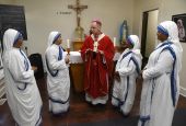 Archbishop Charles Thompson of Indianapolis speaks Sept. 21 with four Missionaries of Charity after celebrating Mass for them at the congregation's Our Lady of Peace Convent, located in one of the city's poorest neighborhoods. The sisters are, from left, 