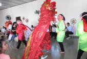 Five sisters of the Daughters of Our Lady of the Visitation perform a lion dance in colorful costumes to bring good luck and fortune to 30 children in their community in the Huong Thuy district of Thua Thien Hue province Sept. 7. 